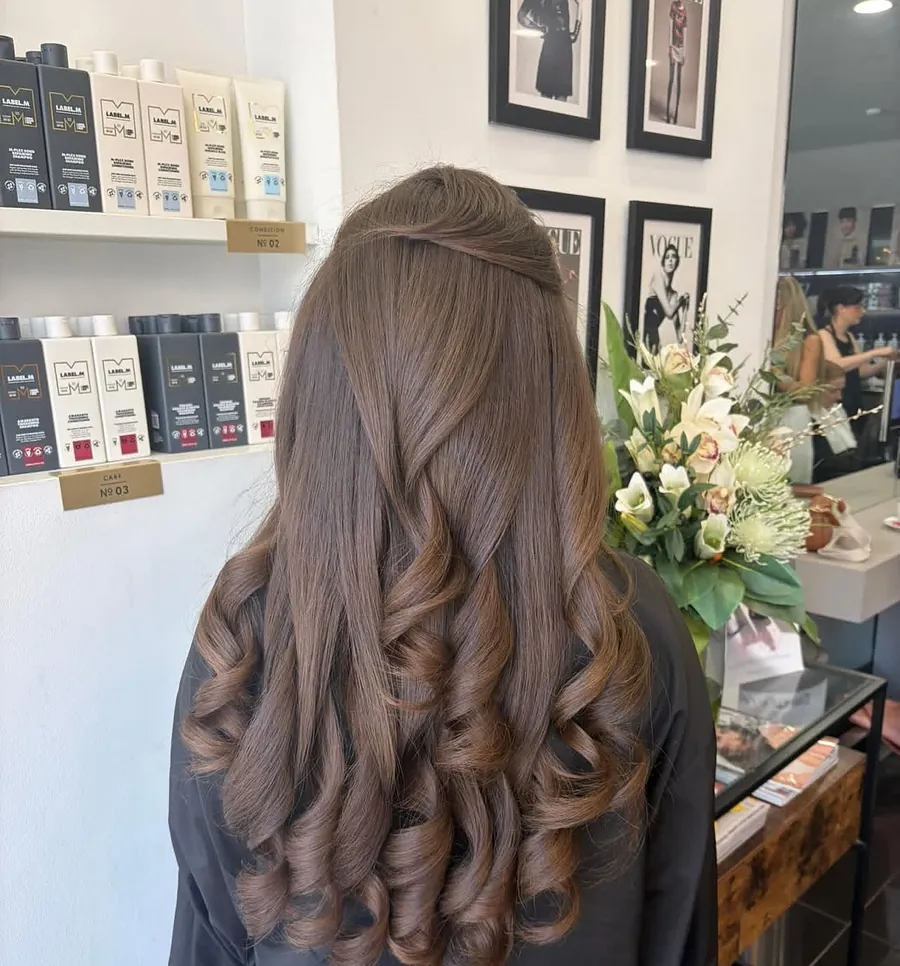 Brunette hair after a fresh trim and bouncy blow-dry