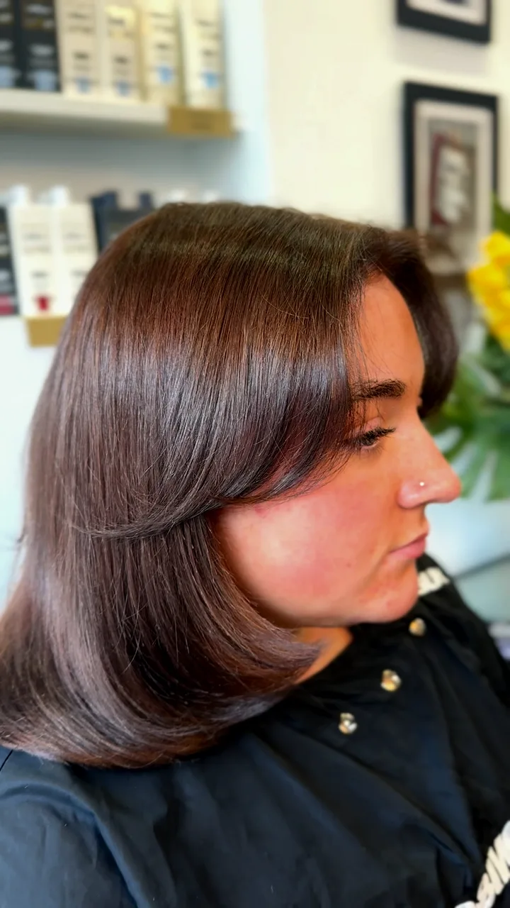 Glossy chocolate brown hair with a soft bend